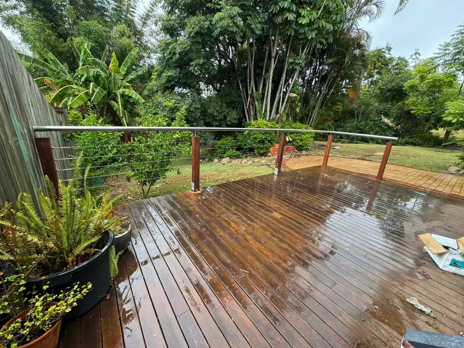 Owner-supplied photo of a timber deck with a cable balustrade