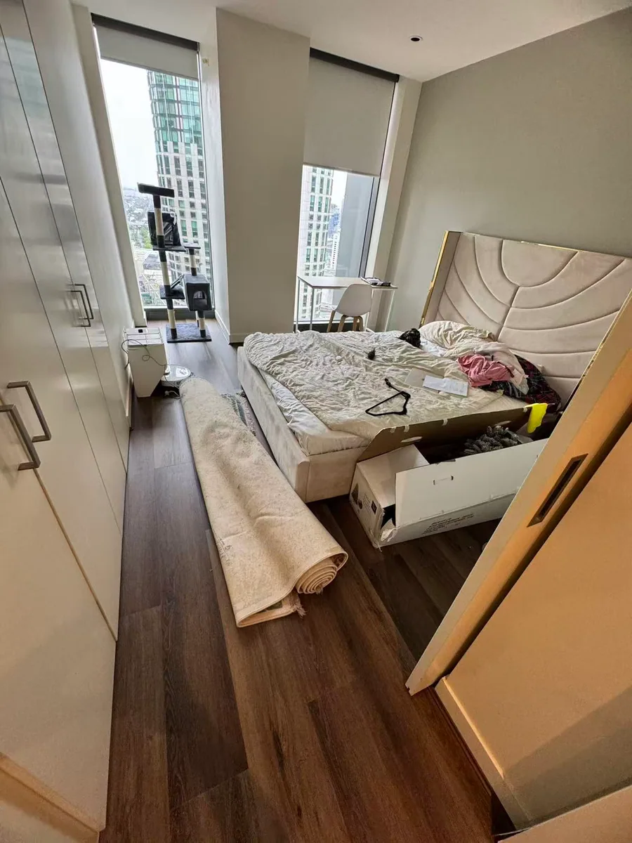 Owner-supplied photo of timber-look flooring through a bedroom doorway