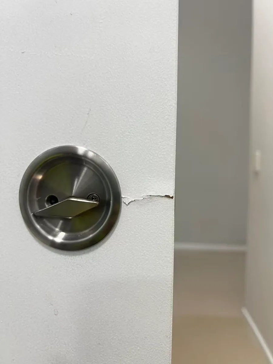 Owner-supplied close photo of a sliding-door guide fitting