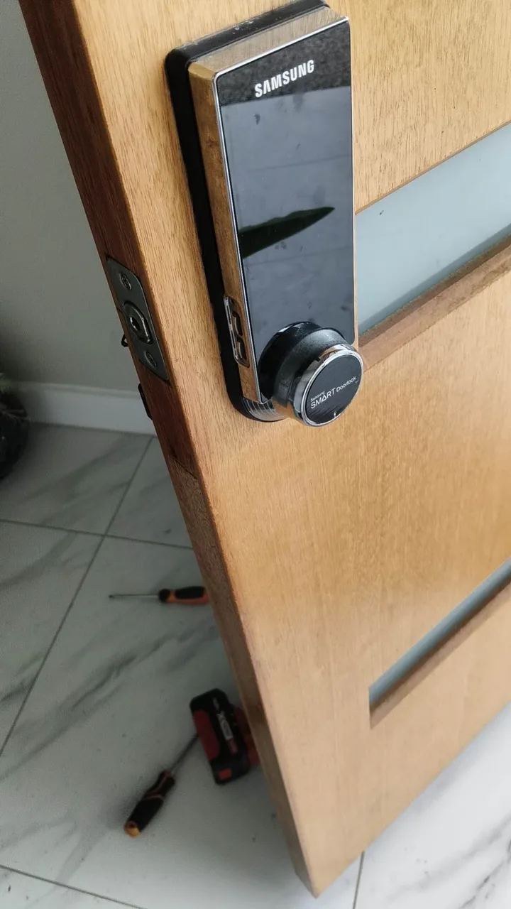 Owner-supplied photo of electronic lock hardware fitted to a timber entry door