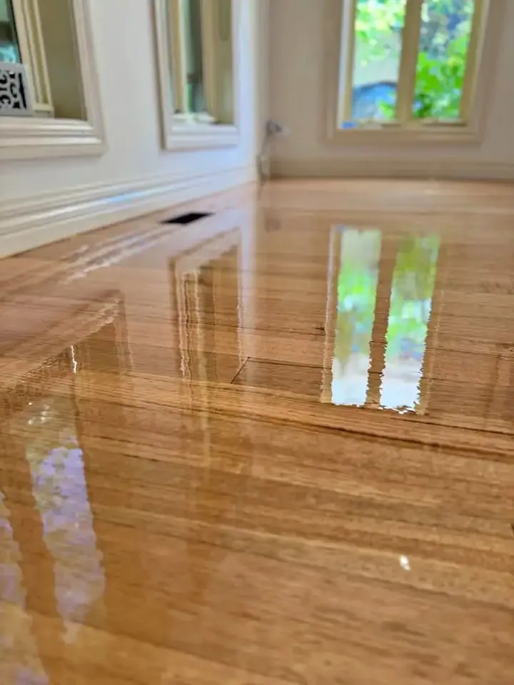 Owner-supplied close photo of a glossy timber floor finish